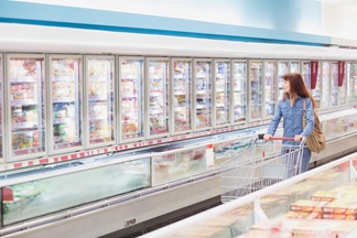 Woman in frozen foods aisle