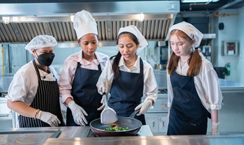 Kids cooking in a kitchen