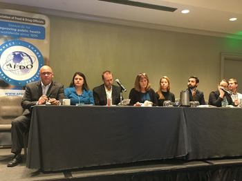 mg-caption: Regulatory stakeholders and industry representatives provide final insights on making the food supply safer by 2030. Left to right: Michael Rogers (FDA), Caitlin Boon (FDA), Erik Mettler (FDA), Roberta Wagner (CBA), Beth Riess (Pew Charitable Trusts), Adam Friedlander (FMI), Denise Eblen (USDA) and Samuel Crowe (CDC). Photo Courtesy of AFDO. 