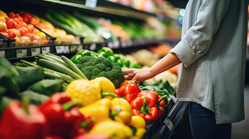 Person looking for produce in grocery store