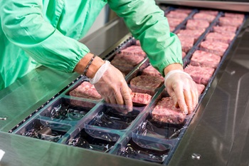Meat on trays in factory