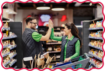 Two people high fiving in a grocery store