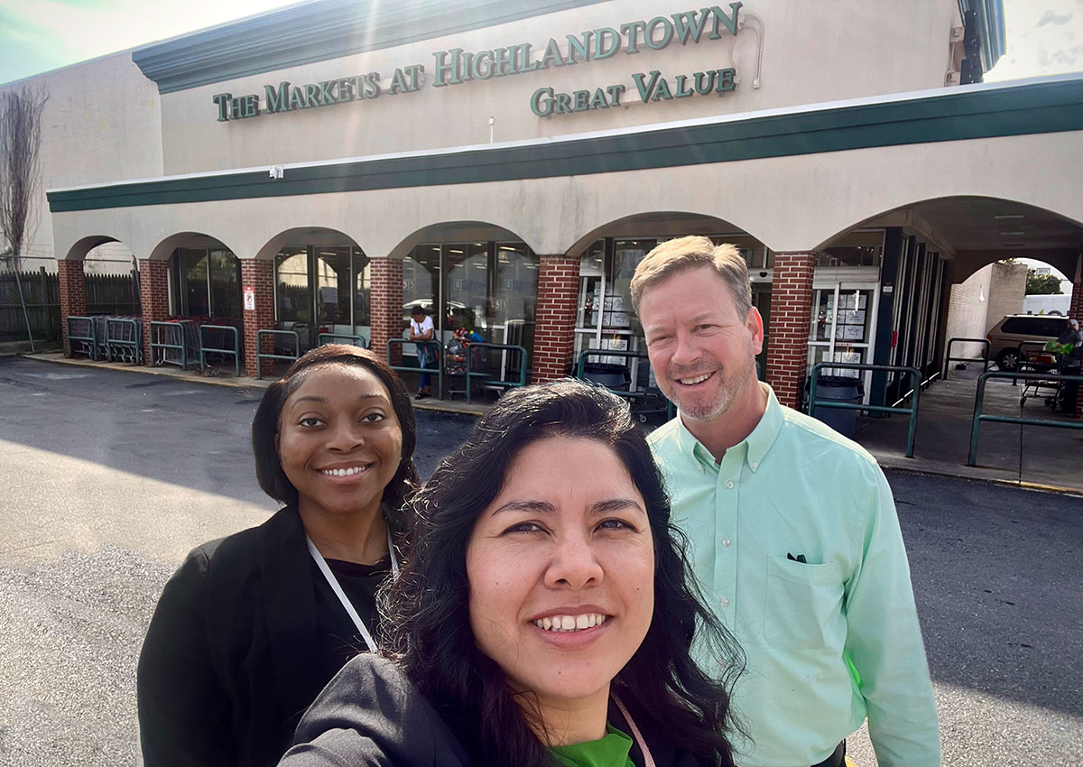 mg-caption: FMI's Briana Carroll, Karina Beltran-Romero and Dan Ratner take a selfie at The Markets at Highlandtown