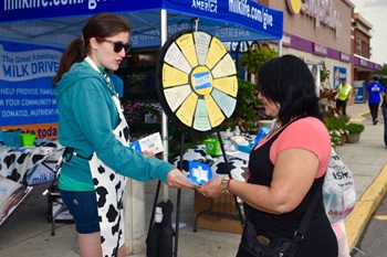 the-great-american-milk-drive_somerville-ma--dairy-farmer-greets-a-customer