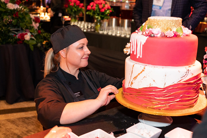 Woman preparing cake in an event